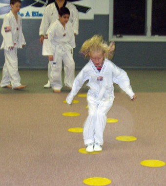 Girl Jumping at Tae Kwon do