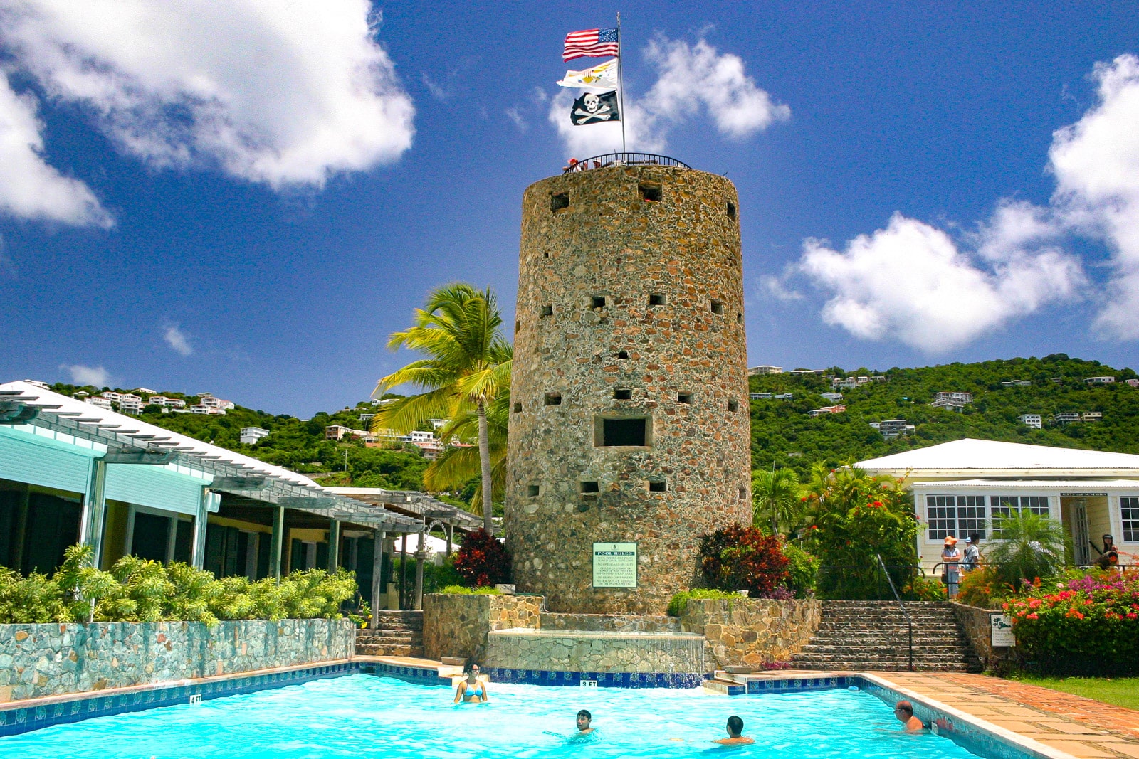 People swimming in pool in front of Blackbeards Castle in St. Thomas, US Virgin Islands.